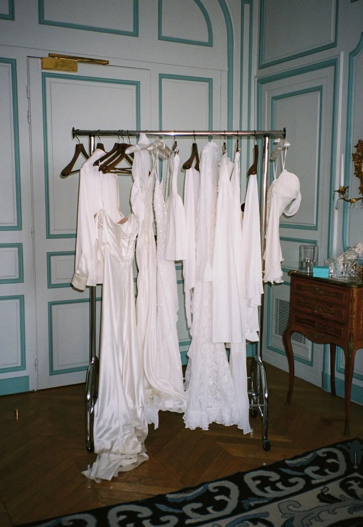 Curated white bridal wardrobe with dresses for different wedding events